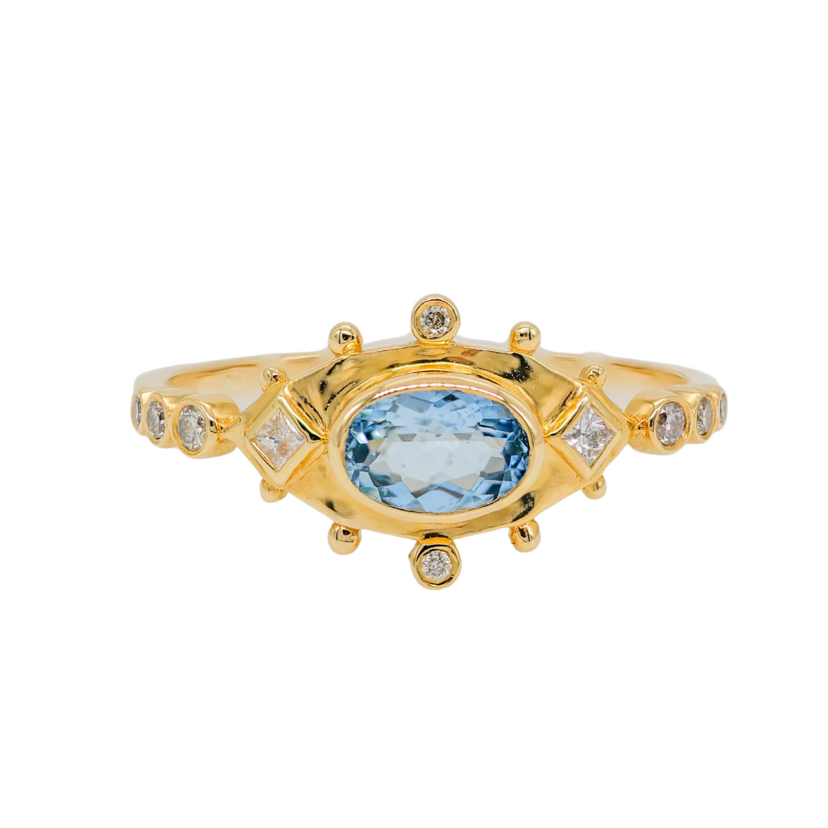 The Celine Daoust Oval Eye Ring - Aquamarine features an oval blue stone and sparkling clear accents in gold.