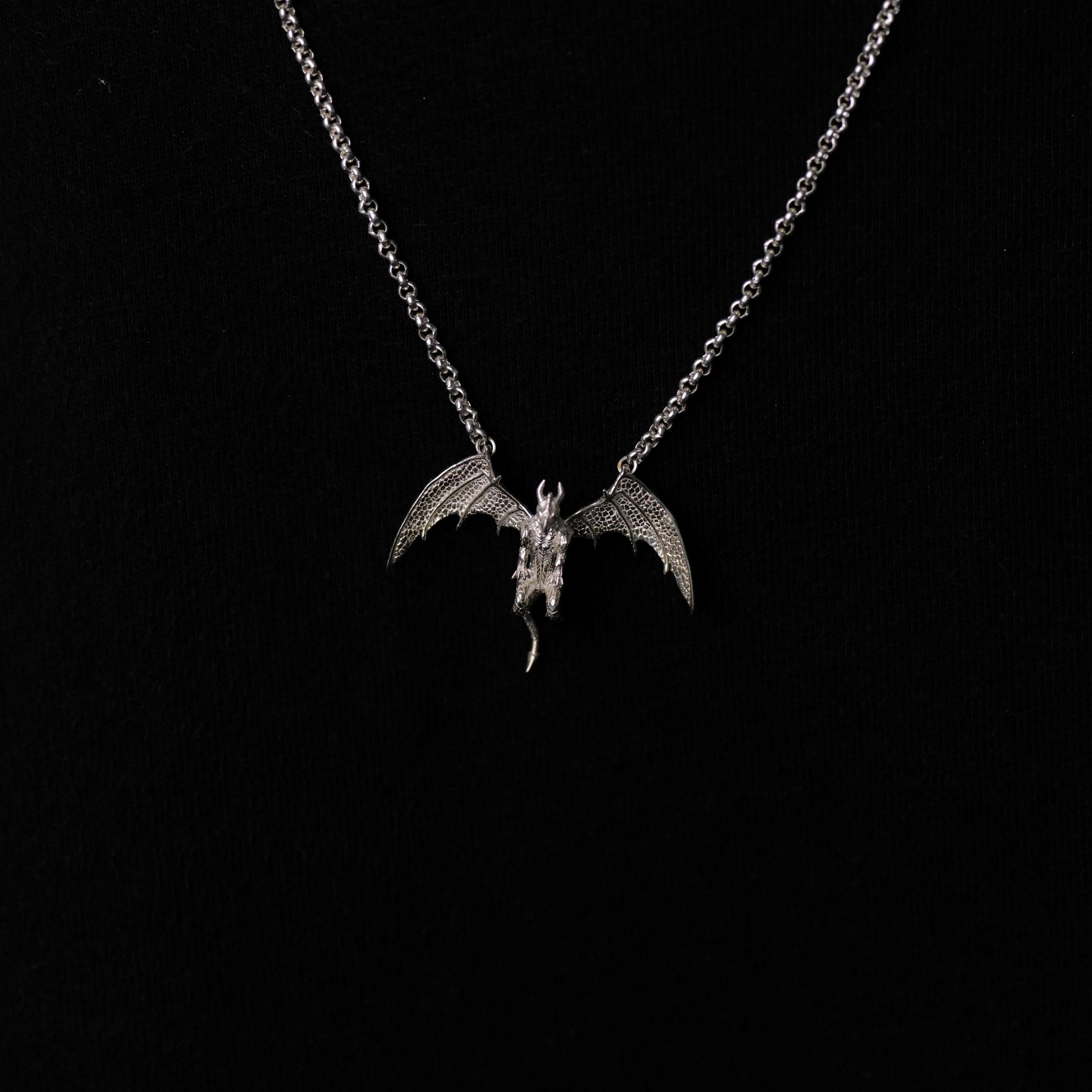 The Fiat Lux Medieval Dragon Necklace (S) features a detailed sterling silver dragon charm on black.