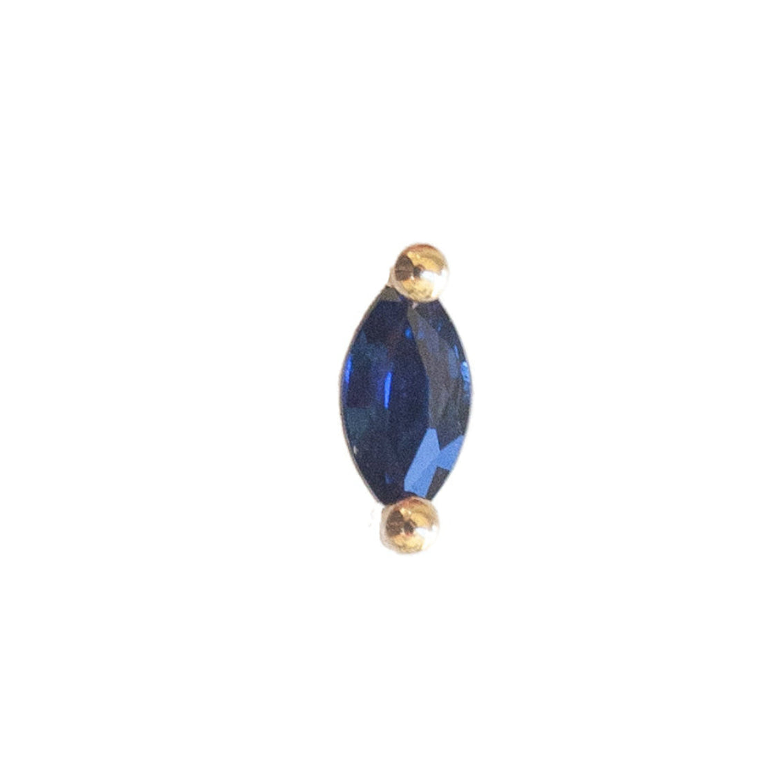 The Fiat Lux Grande Marquise Prong (4x2mm) is a blue stone 14K gold flatback piercing, accented with small beads.