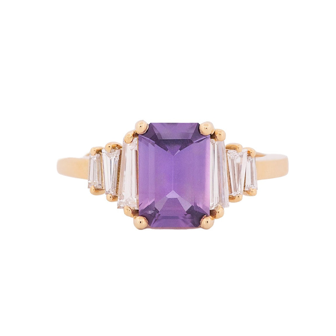 Fiat Lux Grande Calypso ring: 1.94ct mulberry pink sapphire with diamond baguettes on 18K gold, white background.