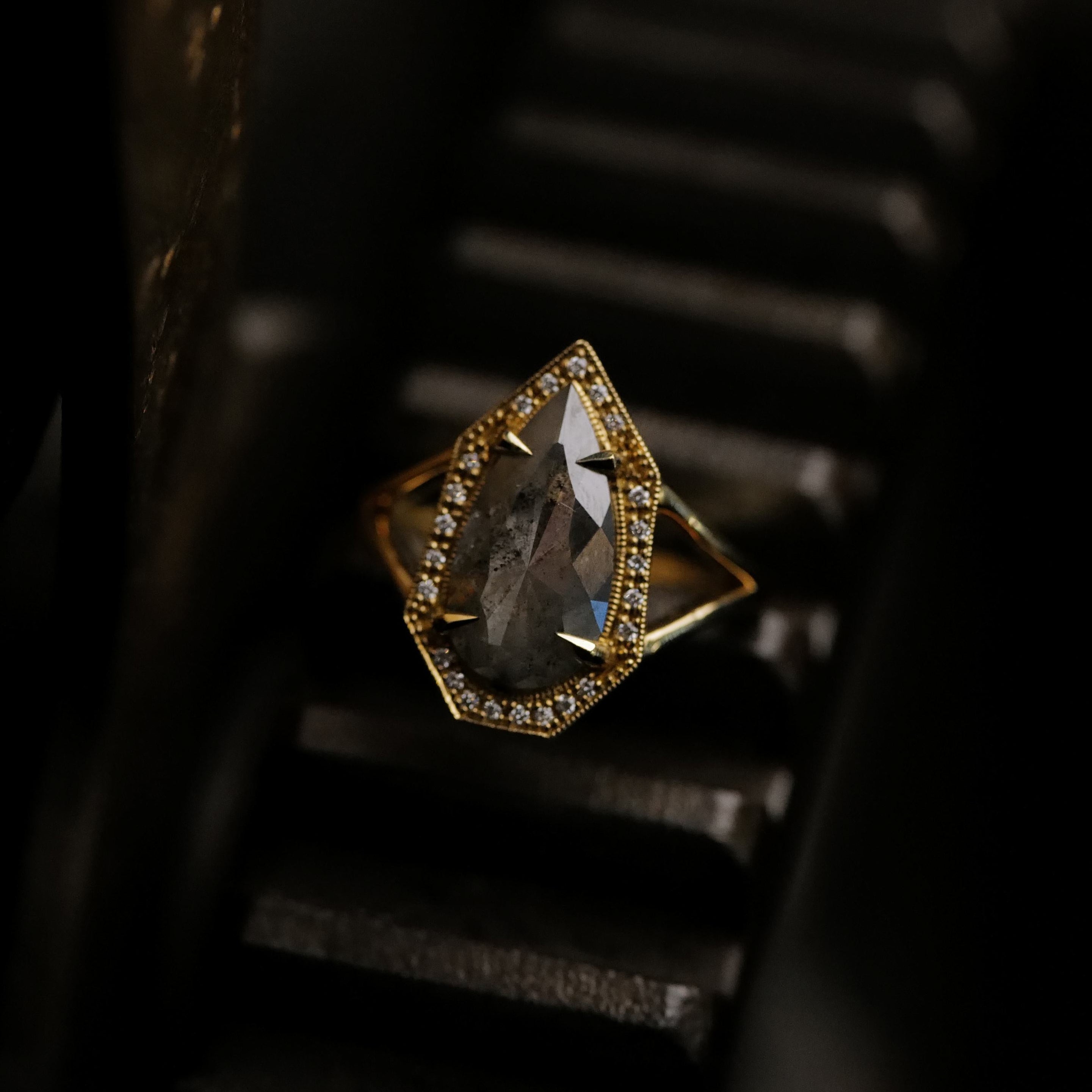 The Fiat Lux Grande Phoebe Ring features a 2.34ct soft grey salt & pepper diamond accented by small diamonds.