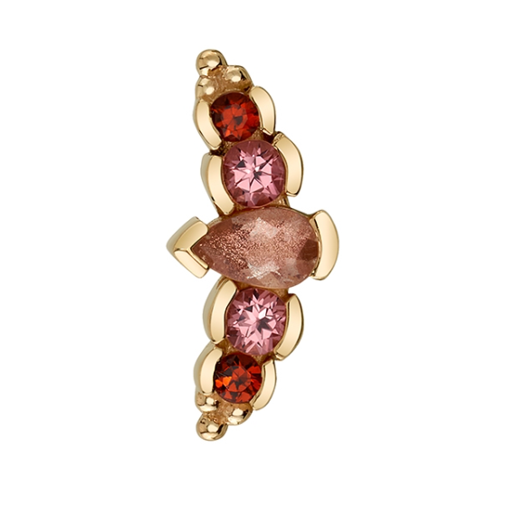 The Nikki Panaraya by BVLA is a gold labret with red, pink, and peach gems in a vertical curved design.