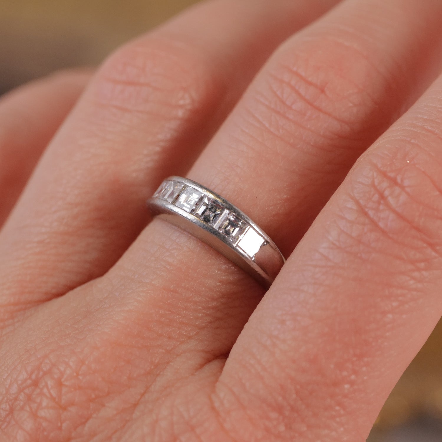 The Vintage Channel Set Carré Diamond Ring by Vintage, featuring carré cut diamonds in a platinum band.