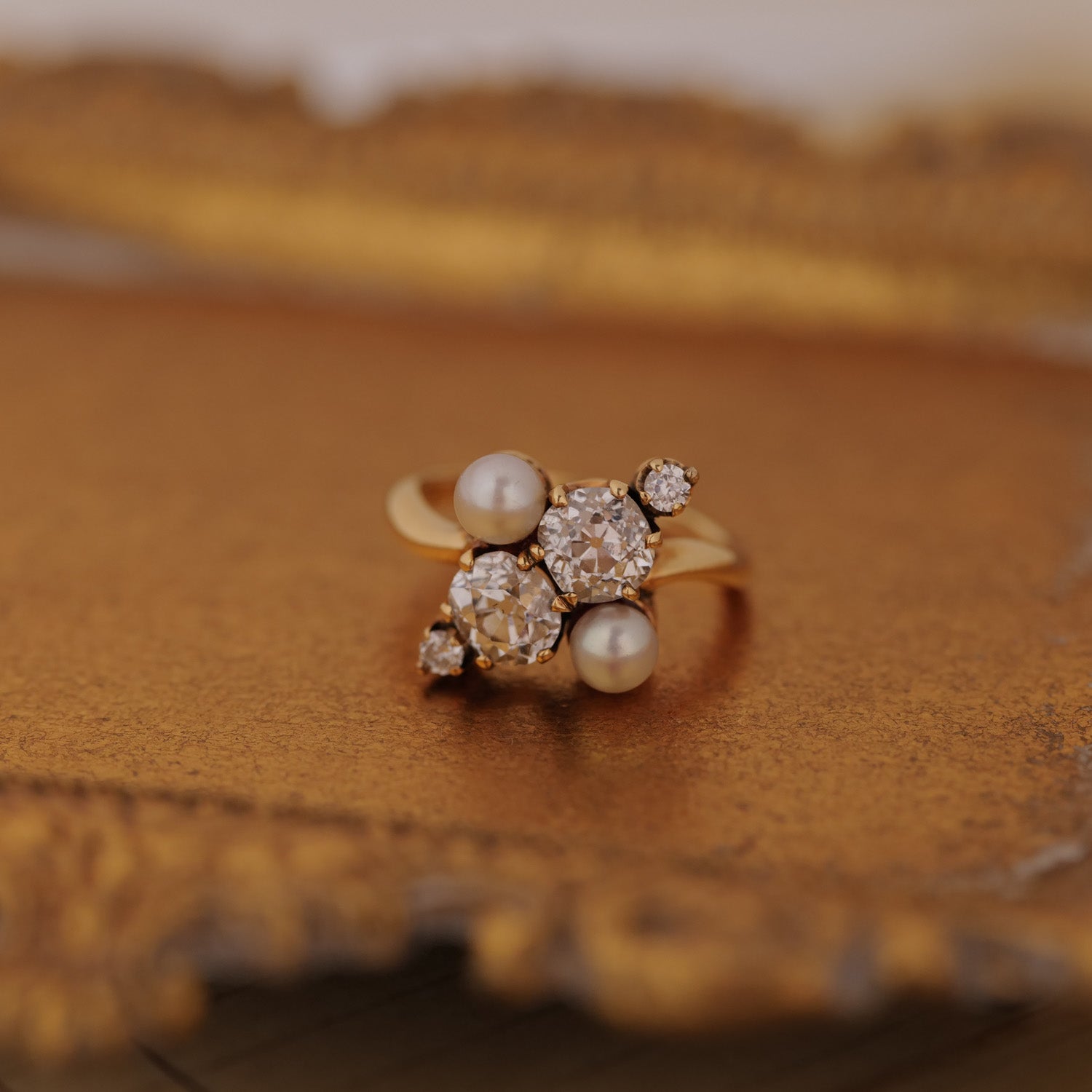 The Vintage Double Pearl Diamond Ring by Vintage features antique pearls and an Old European-cut diamond on gold.