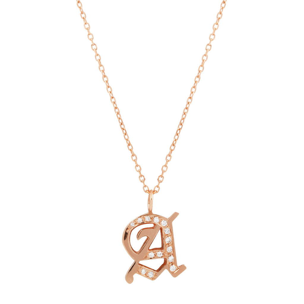 Georgie Gold Ideogram Charm: 14K Gold necklace with a gothic A pendant and sparkling clear stone accents.