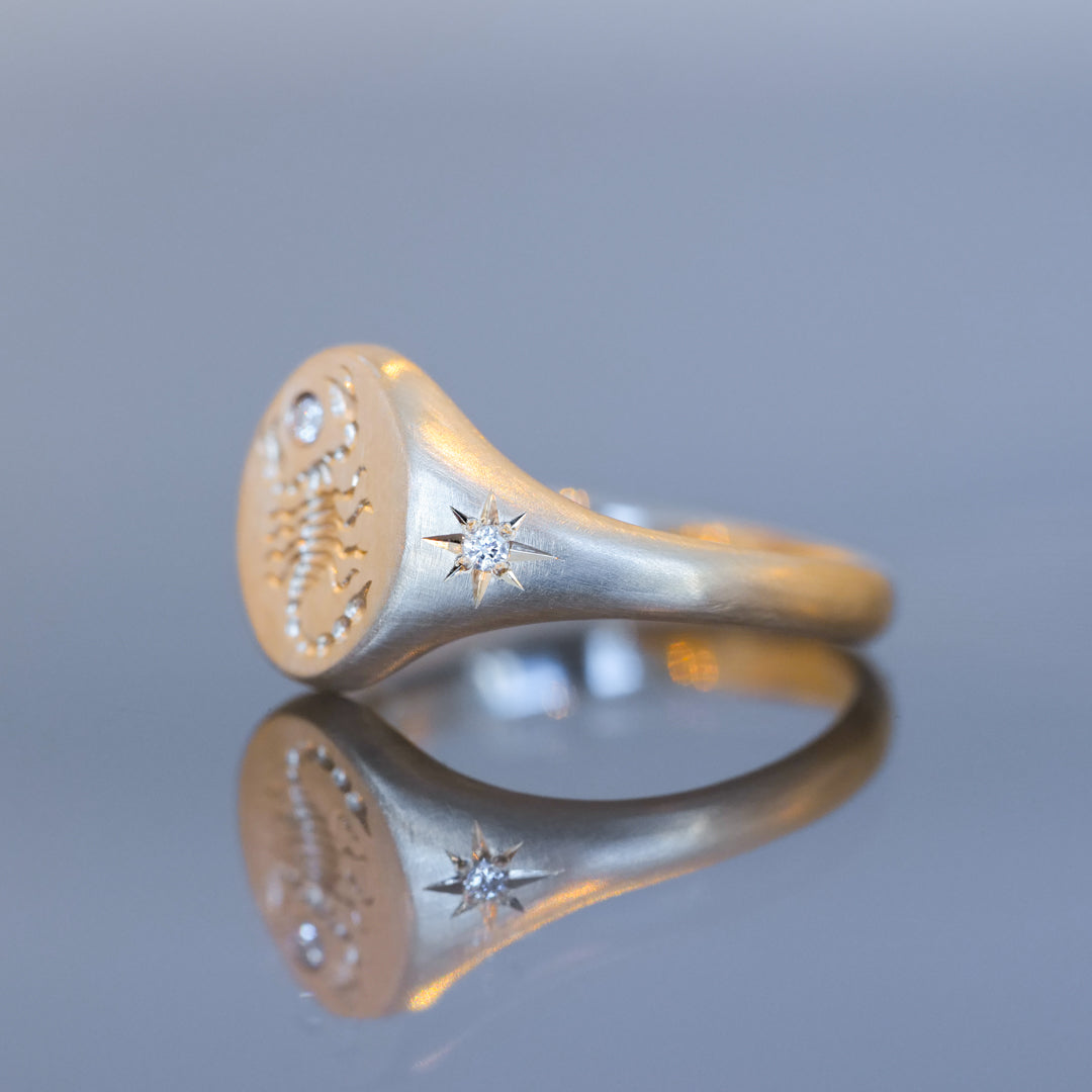 Blue Blue Driver’s Scorpion Signet Ring - Diamond features a 14k gold scorpion engraving and star-shaped white diamond.