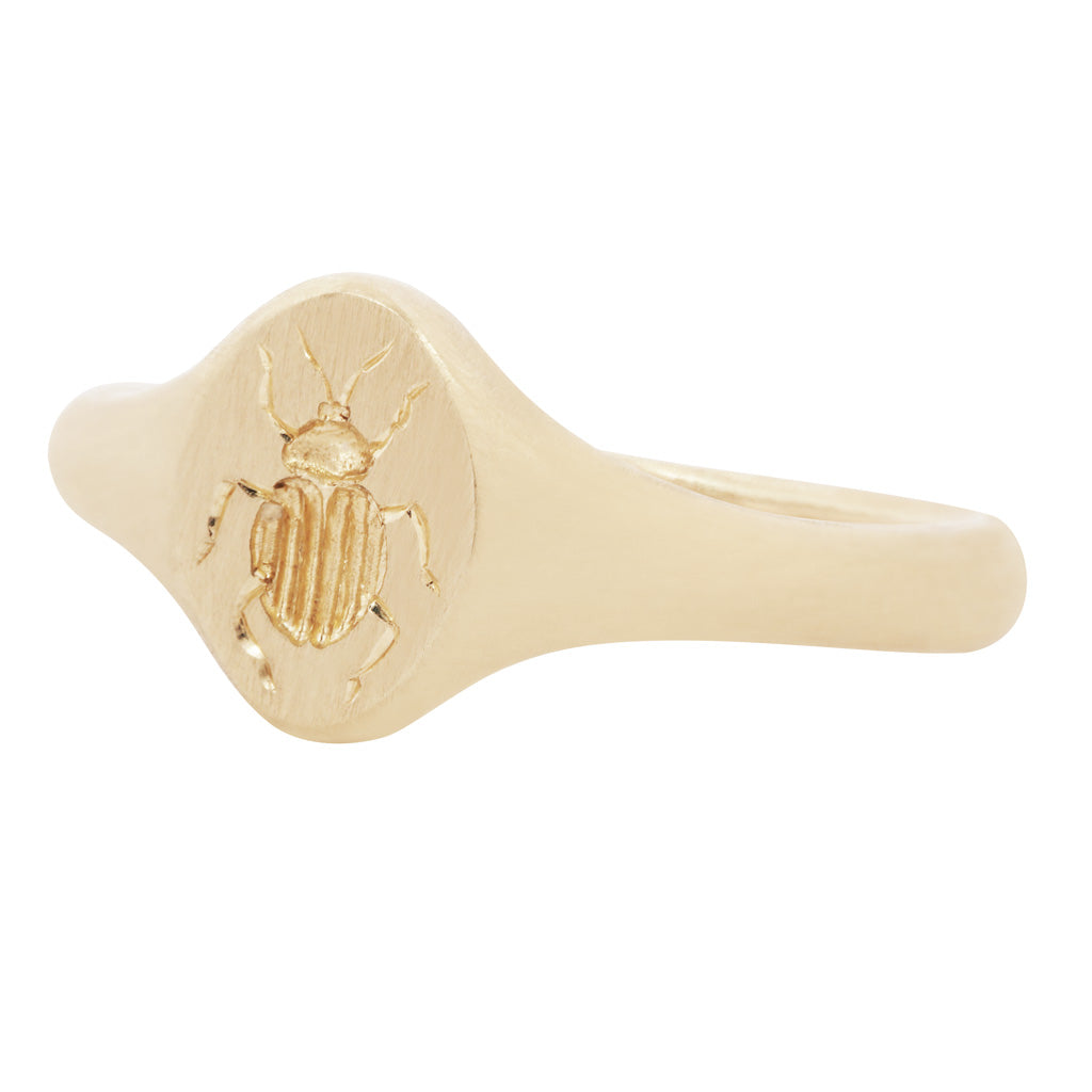 Blue Blue Drivers Tiniest Scarab Signet Ring: 14K gold with a flat engraved scarab, symbolizing renewal.