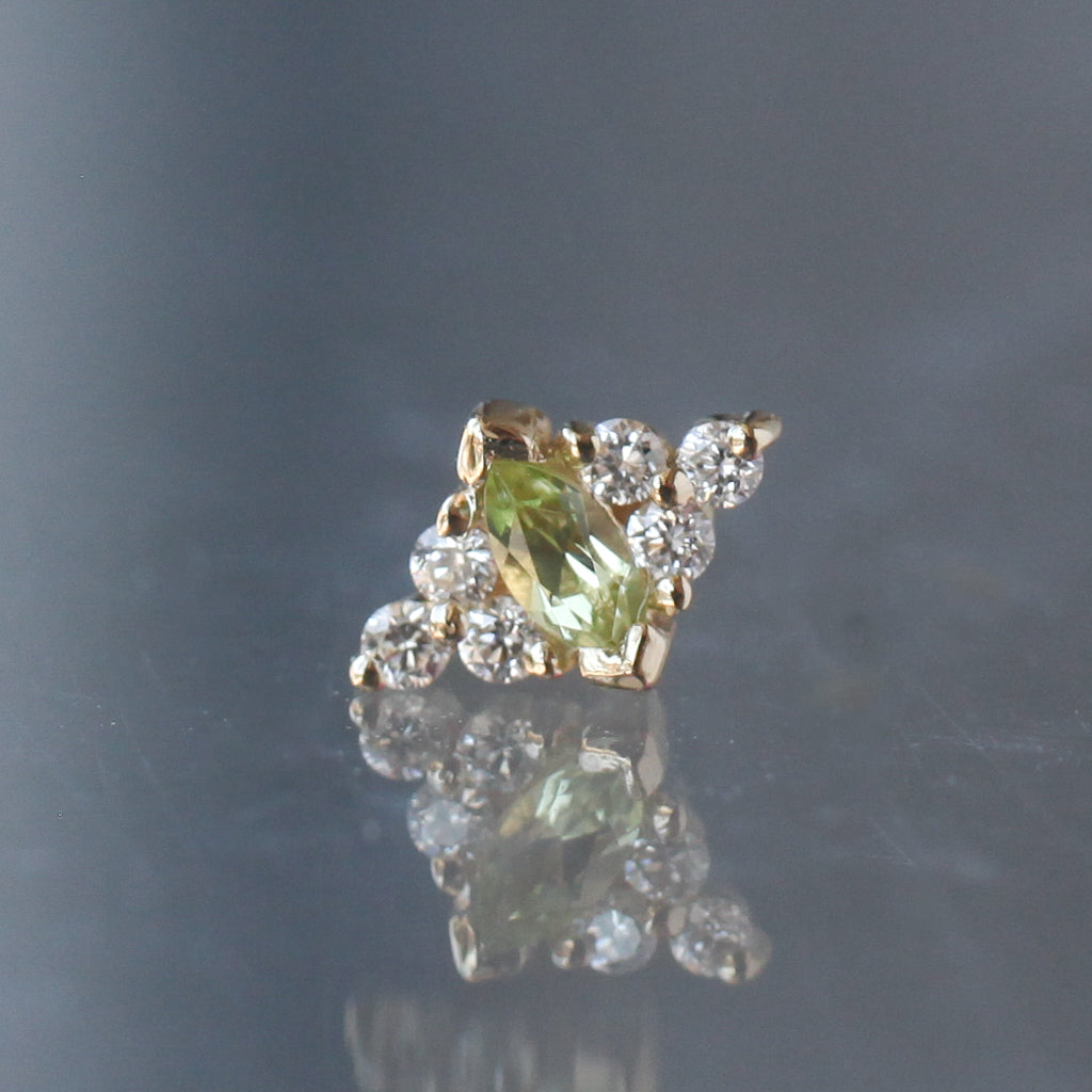 BVLA Embrace Marquise gold stud earring with a marquise-cut green gemstone surrounded by round diamonds in a flatback design.