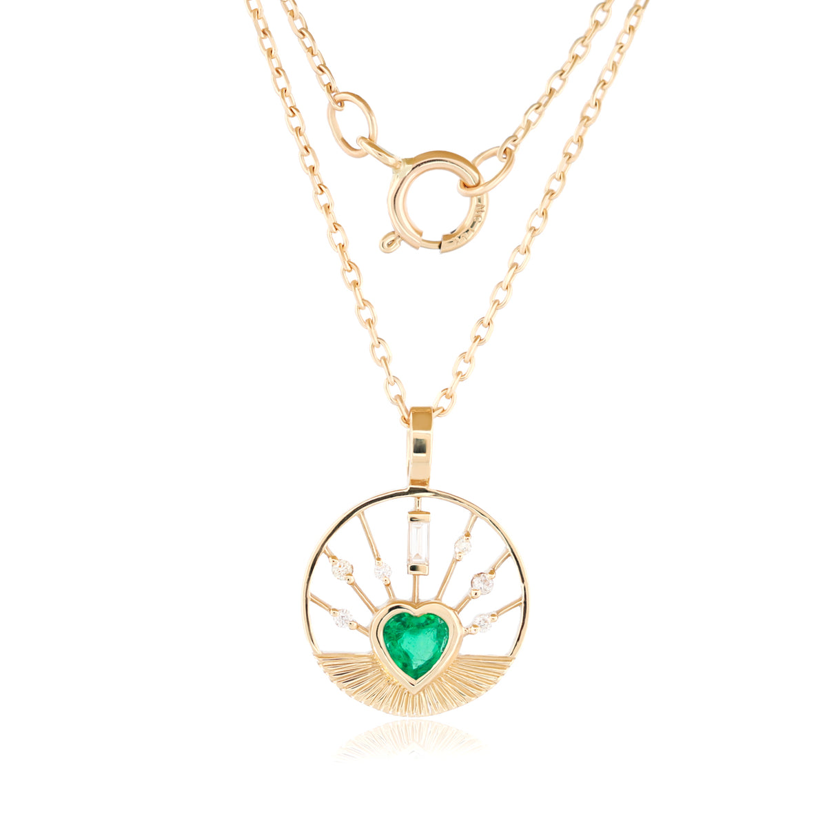 Celine Daoust Heart Medal Necklace - Emerald: a 14K gold circular pendant with a heart-shaped emerald and diamond accents.