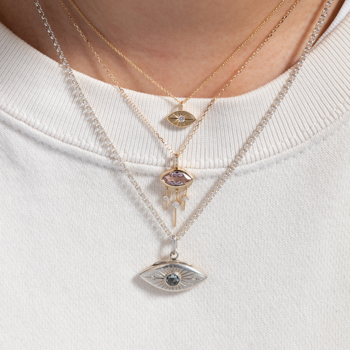 Celine Daoust Marquise Eye with Diamond Dangles: three layered 14k gold necklaces with tanzanite pendants and diamonds.