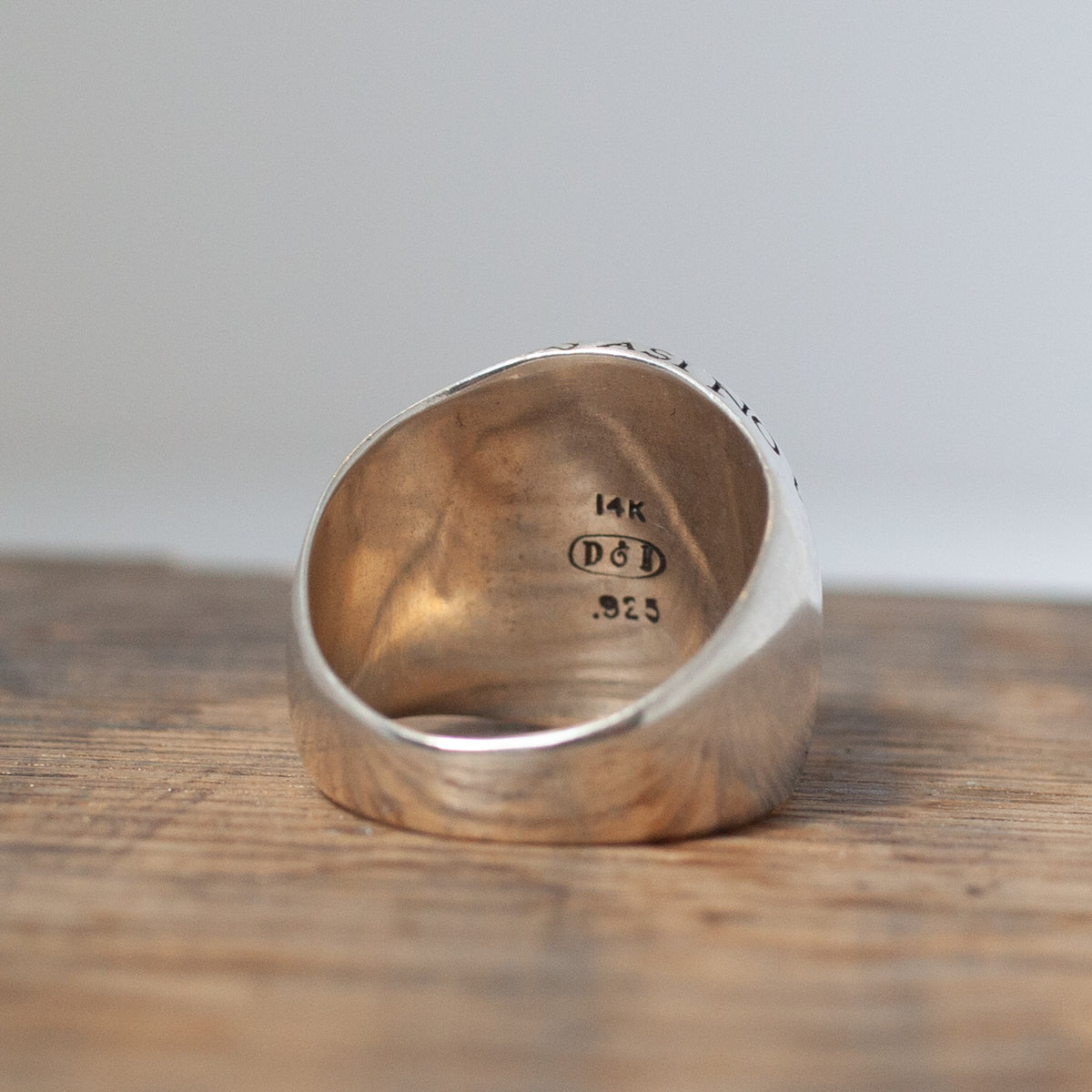 Kahlo Signet Ring by Digby & Iona: wide silver band, engraved inside with 14K, D&D, .925; talisman on wood.