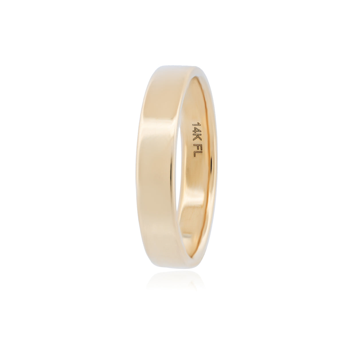 Classic Flat Band (4mm) by Fiat Lux, a simple 14K gold ring with 14K FL engraved on the inner surface.