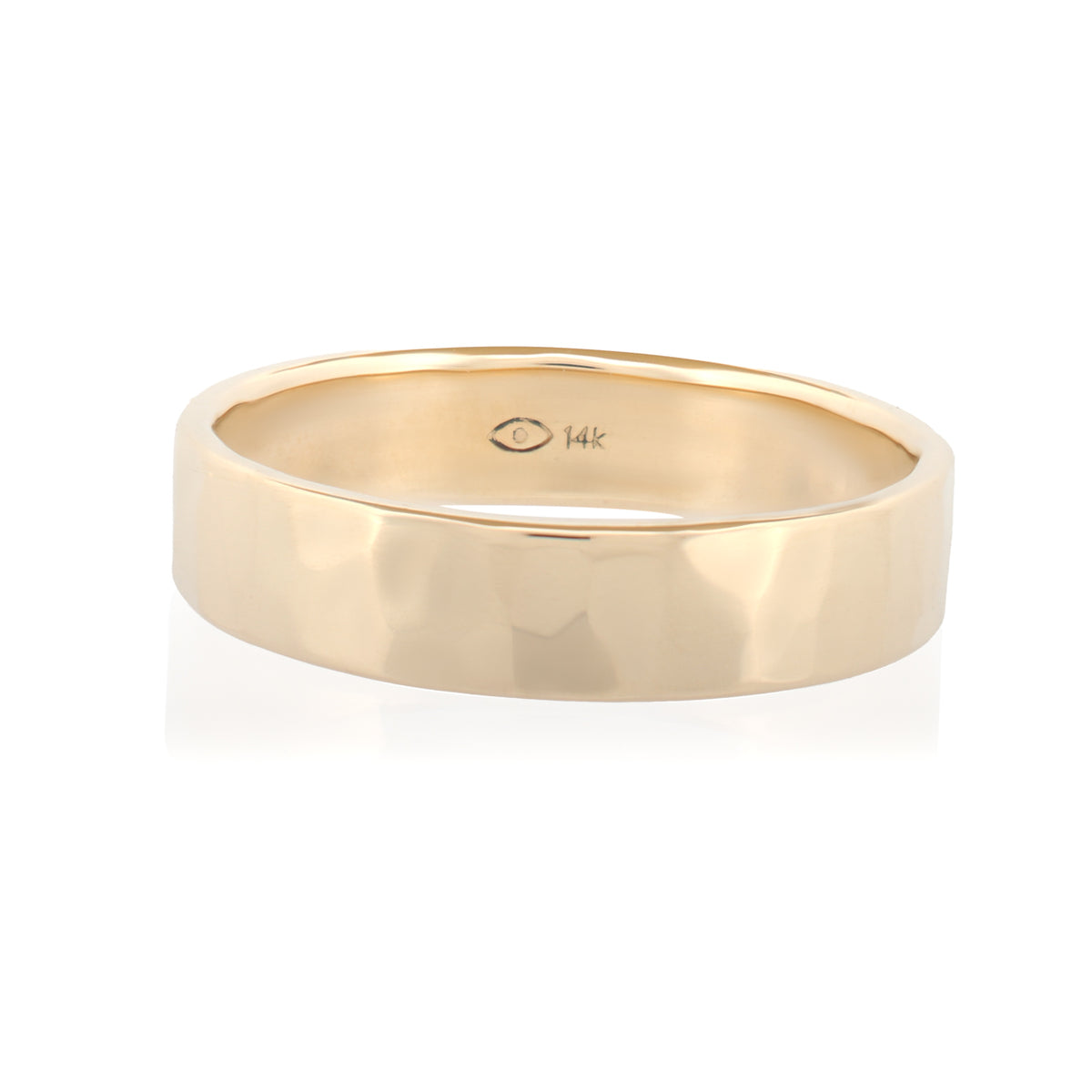 A 14k gold Fiat Lux Classic Flat Band (5mm) with a hammered texture and an interior hallmark.