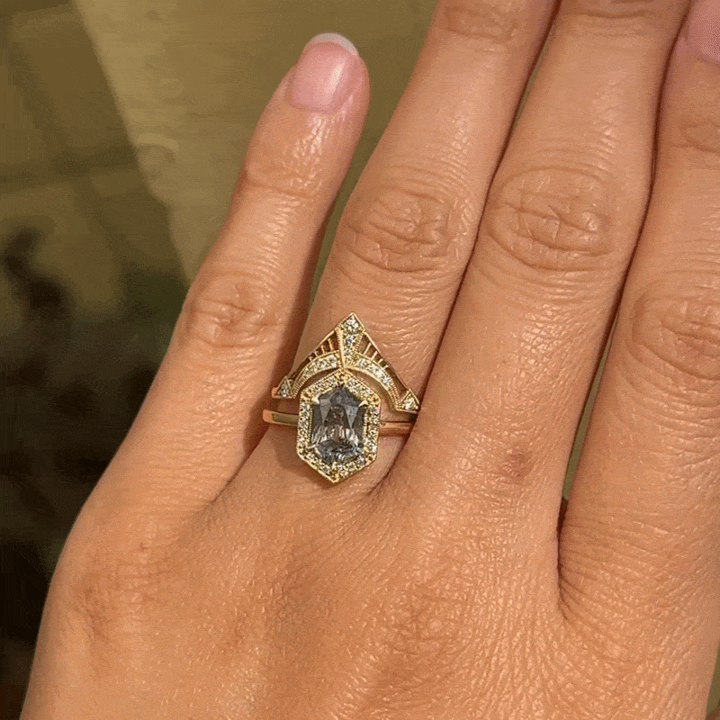 A Fiat Lux Grande Hex Hester ring with an 18K gold hexagonal minty grey lavender sapphire and a geometric pavé setting.