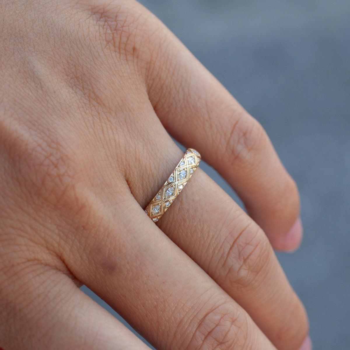 Serpentra Ring - Marquise Diamond 14k gold band featuring a diamond-studded, diamond-shaped lattice pattern on a finger.
