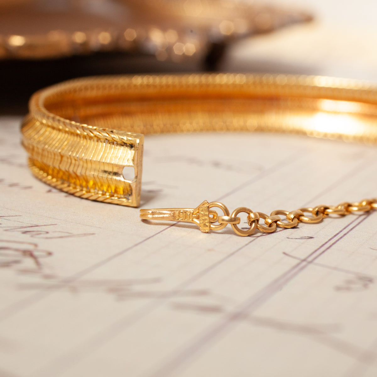 Vintage Biedermeier Soft Bracelet in 18k gold with a flexible woven design, clasp, and safety chain.