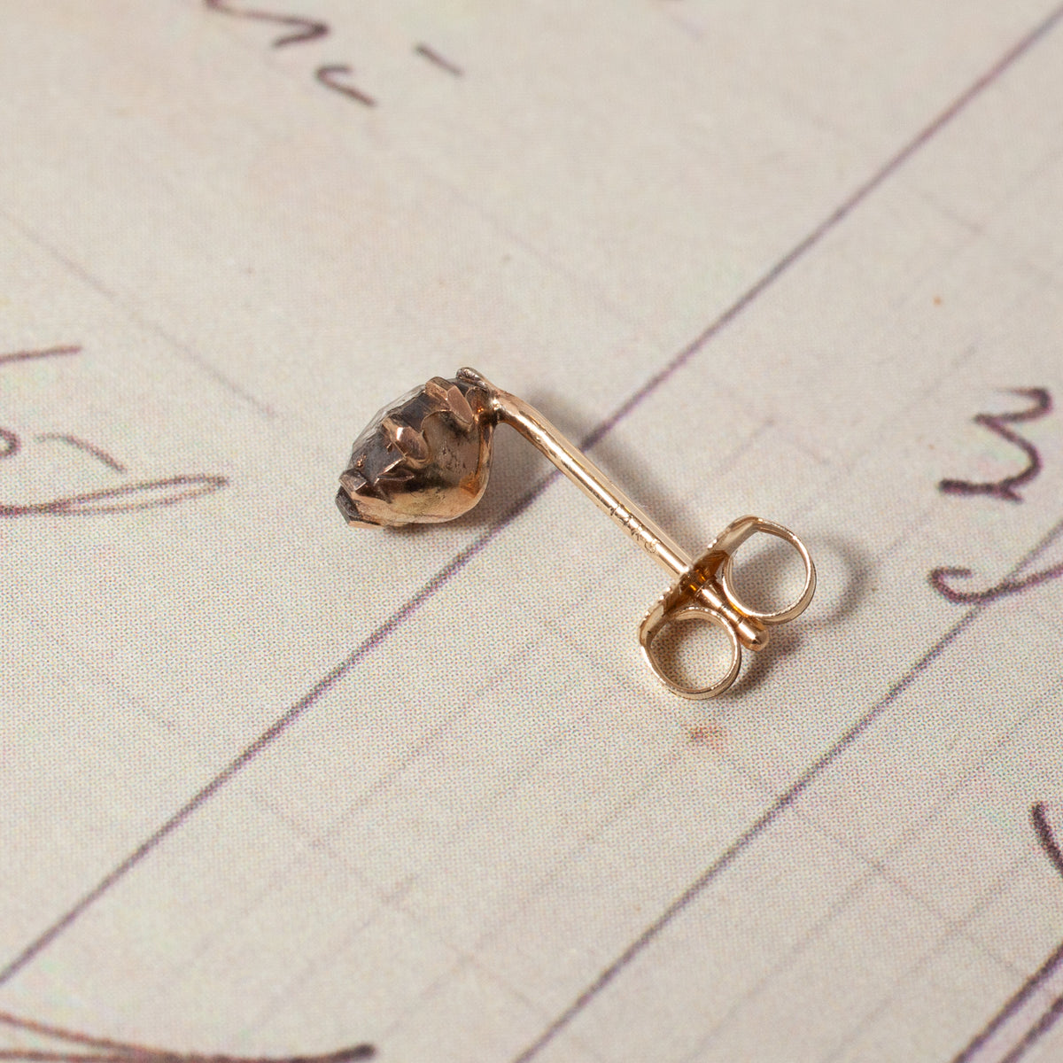 A Vintage Victorian Rose Cut Single Earring featuring a rose-cut stone in a silver-over-gold setting.