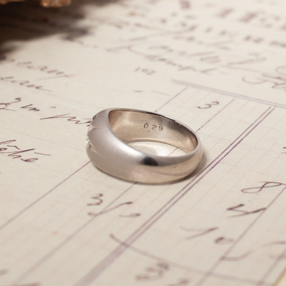 A silver-toned Vintage Domed Star Set Diamond Ring with a domed band, showing a hallmark reading 029 inside.