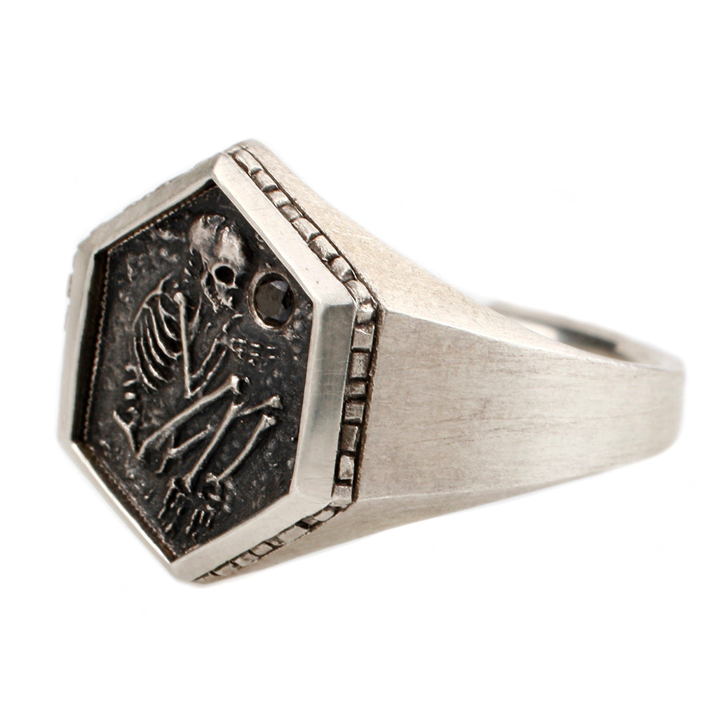 the sterling silver shallow grave ring by dmd metal on a left-side profile