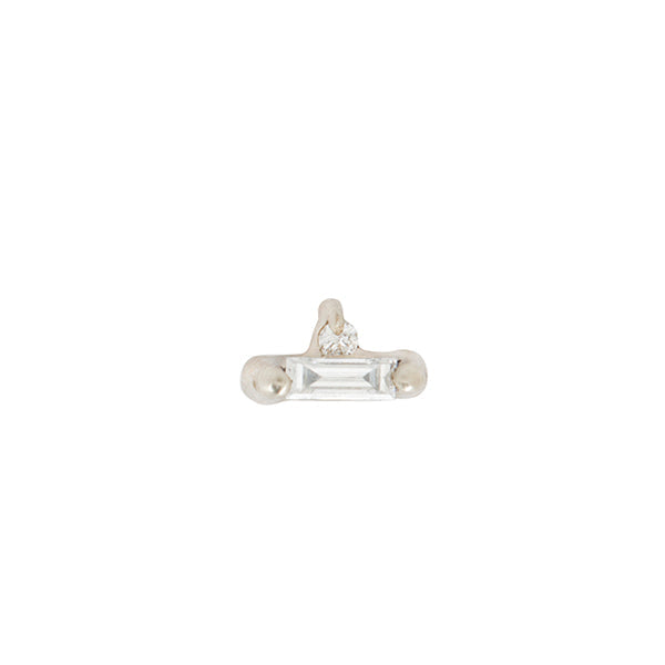 The Indira Stud by Fiat Lux features a silver flatback with a baguette-cut diamond and tiny round gem below.