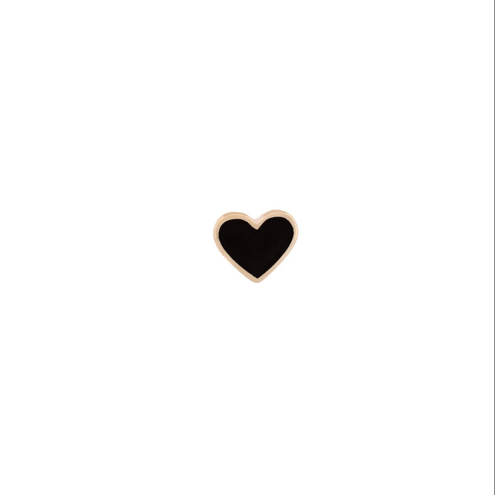 A small heart-shaped enamel pin with a black center and a yellow gold border, centered on a plain white background.
