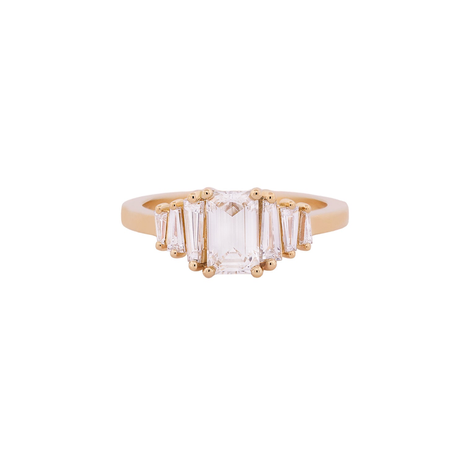 Fiat Lux Classic Calypso ring: 1.02ct emerald cut diamond, tapered baguettes, set in 18K gold.