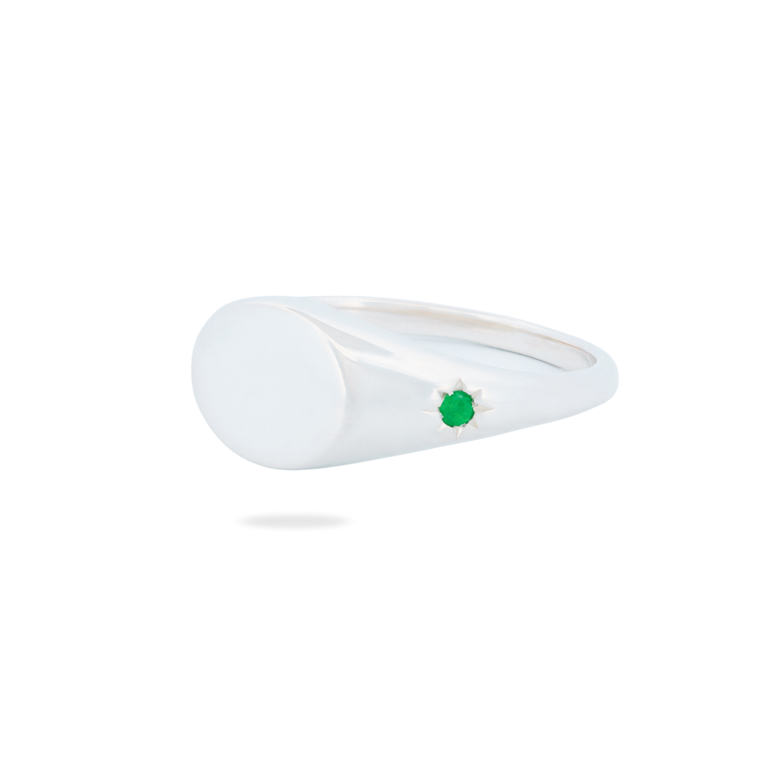 Fiat Lux Classic Horizontal Oval Signet Ring (S) with a star-set green gemstone on a plain silver face.