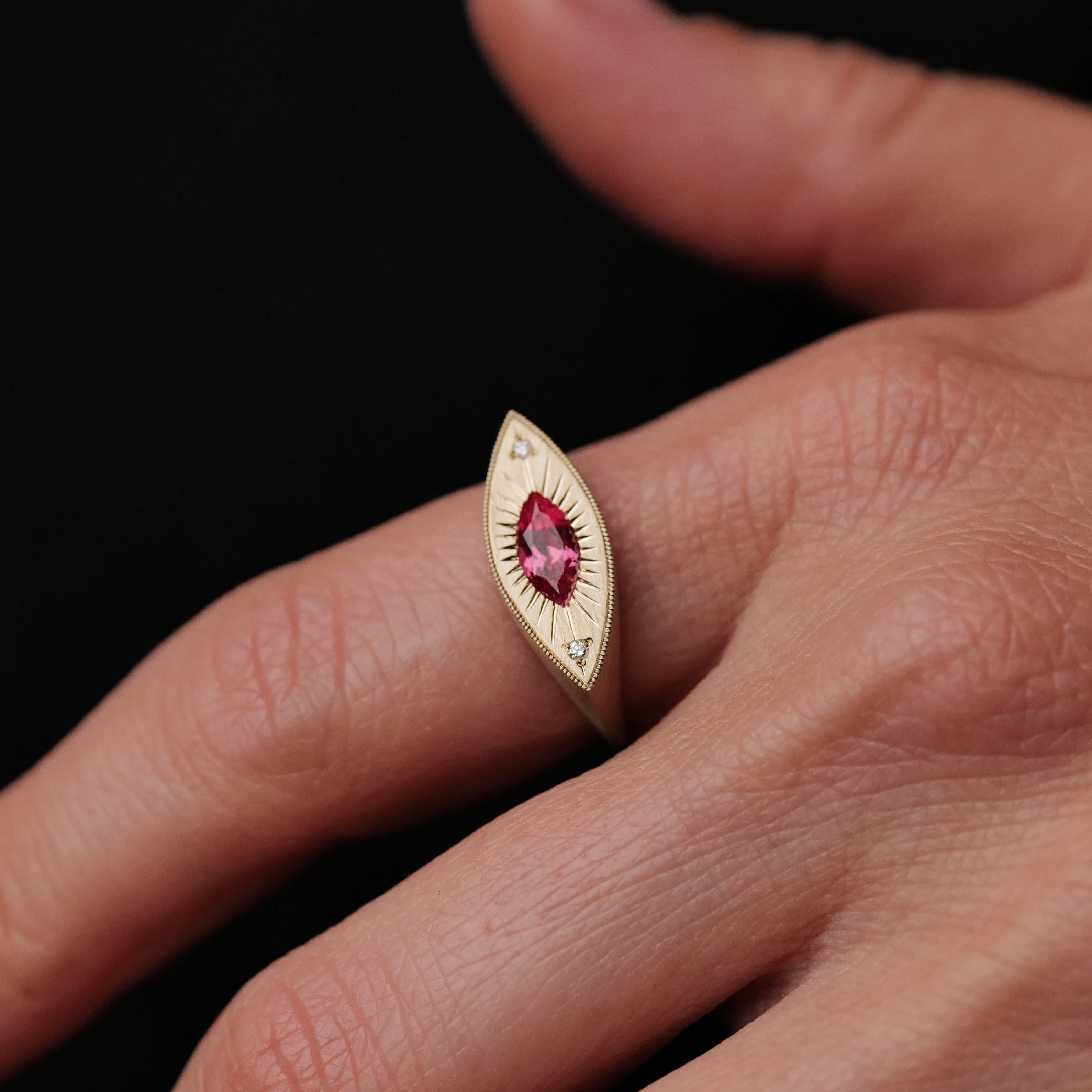 Fiat Lux’s Brilliant Third Eye ring features a 0.63ct Summer Coral Sapphire and two diamonds in elegant 14K gold.