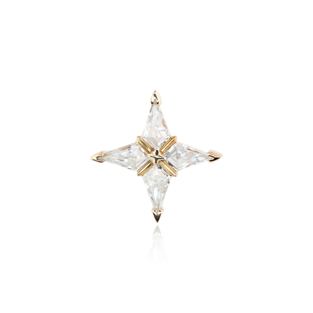 A four-pointed star-shaped gold ring featuring clear marquise-cut gemstones, centered on a solid white background with a faint reflection below.