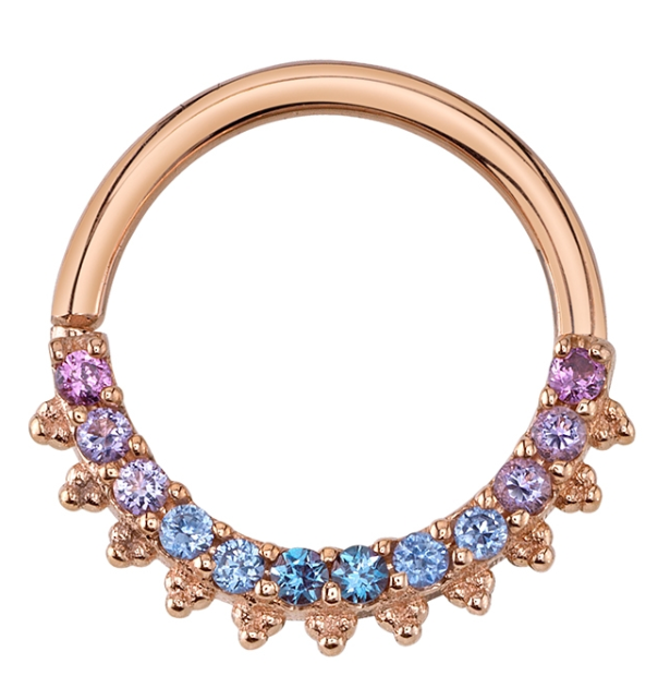 Eleanor rose gold seam ring hoop earring decorated with a row of gradient purple and blue gemstones and small gold beads.