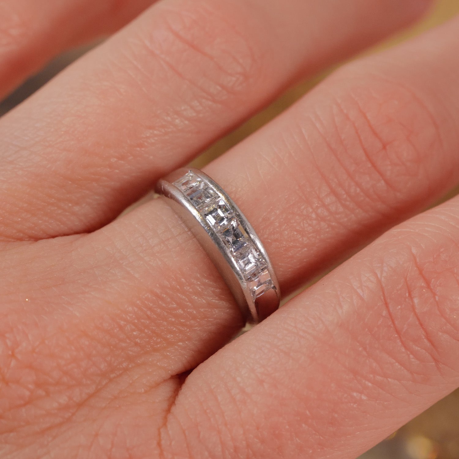 Vintage Channel Set Carré Diamond Ring by Vintage features rectangular clear diamonds in a silver band.