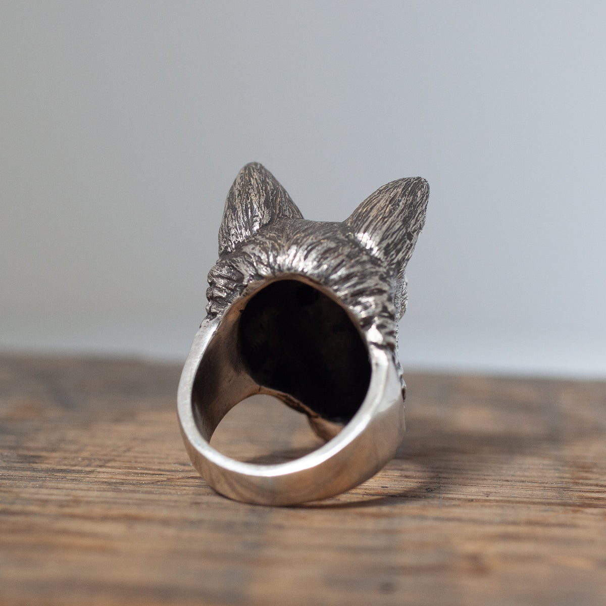 The Amarok Ring by Allison Bartline: sterling silver wolf, pointed ears, textured fur, black spinel accents.