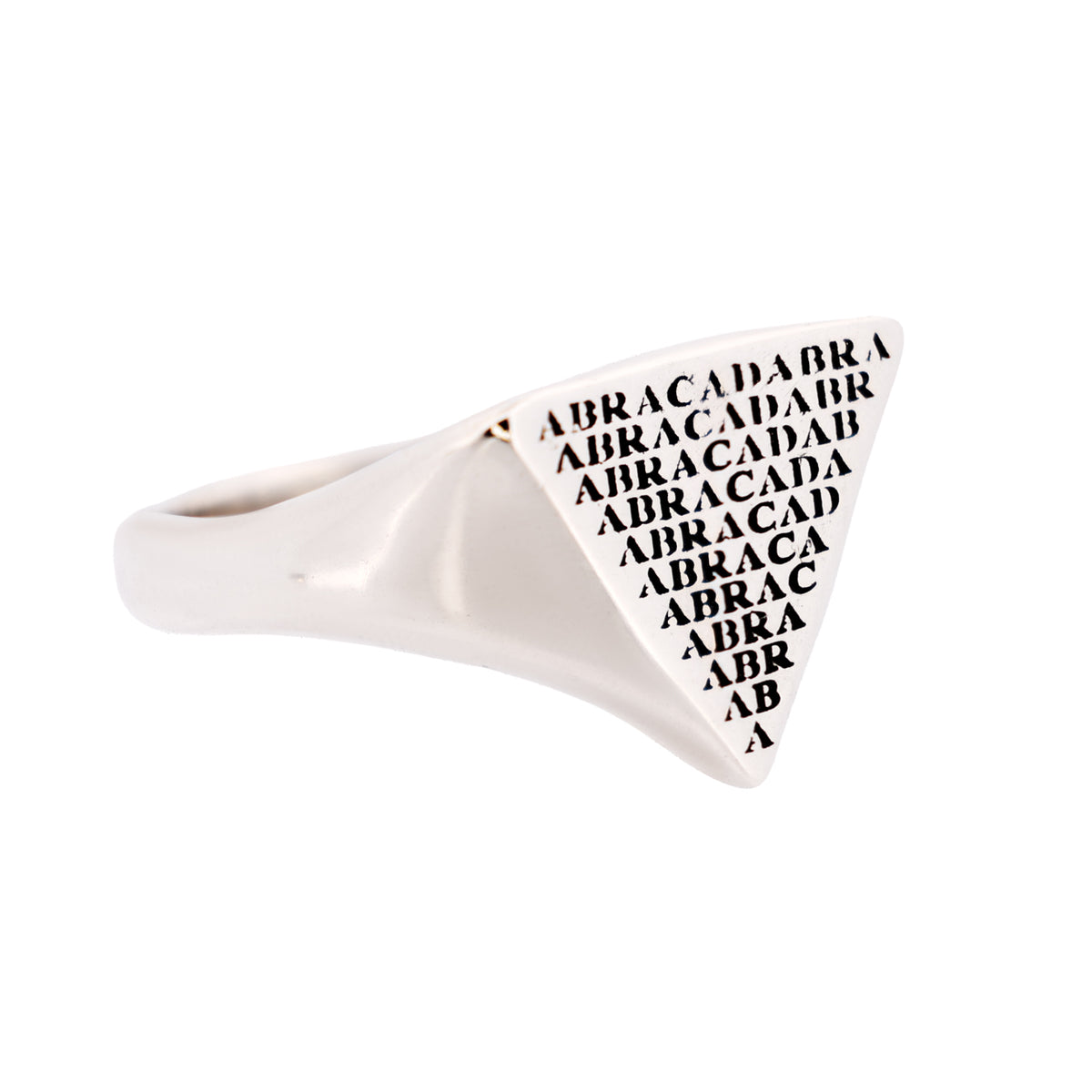 Digby & Iona Abracadabra Signet Ring: a sterling silver triangular ring engraved with repeating, diminishing text.