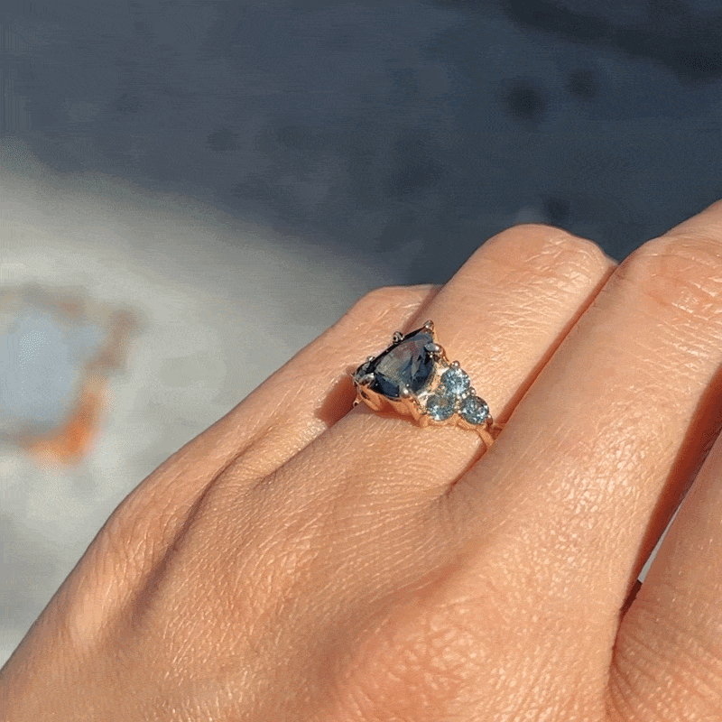 Nico Ring - Teal Pear Sapphire (2.07ct) in 18K gold featuring a pear-shaped teal sapphire with three blue stone accents.