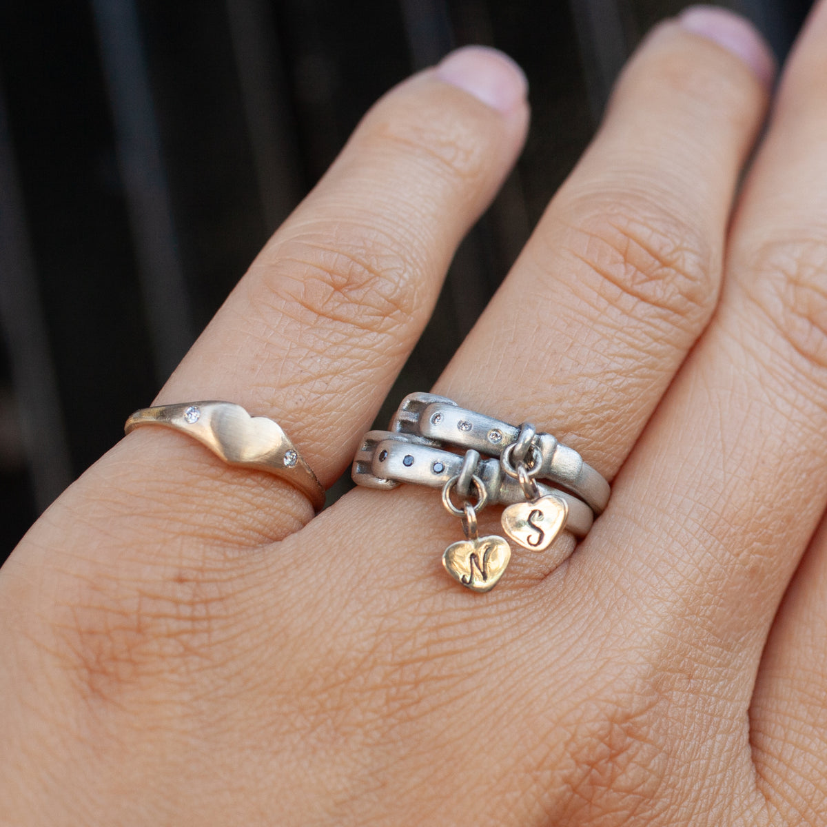 Two Little Love Pet Collar Ring - Black Diamond sterling silver rings: one heart, one belt-style with two heart charms.