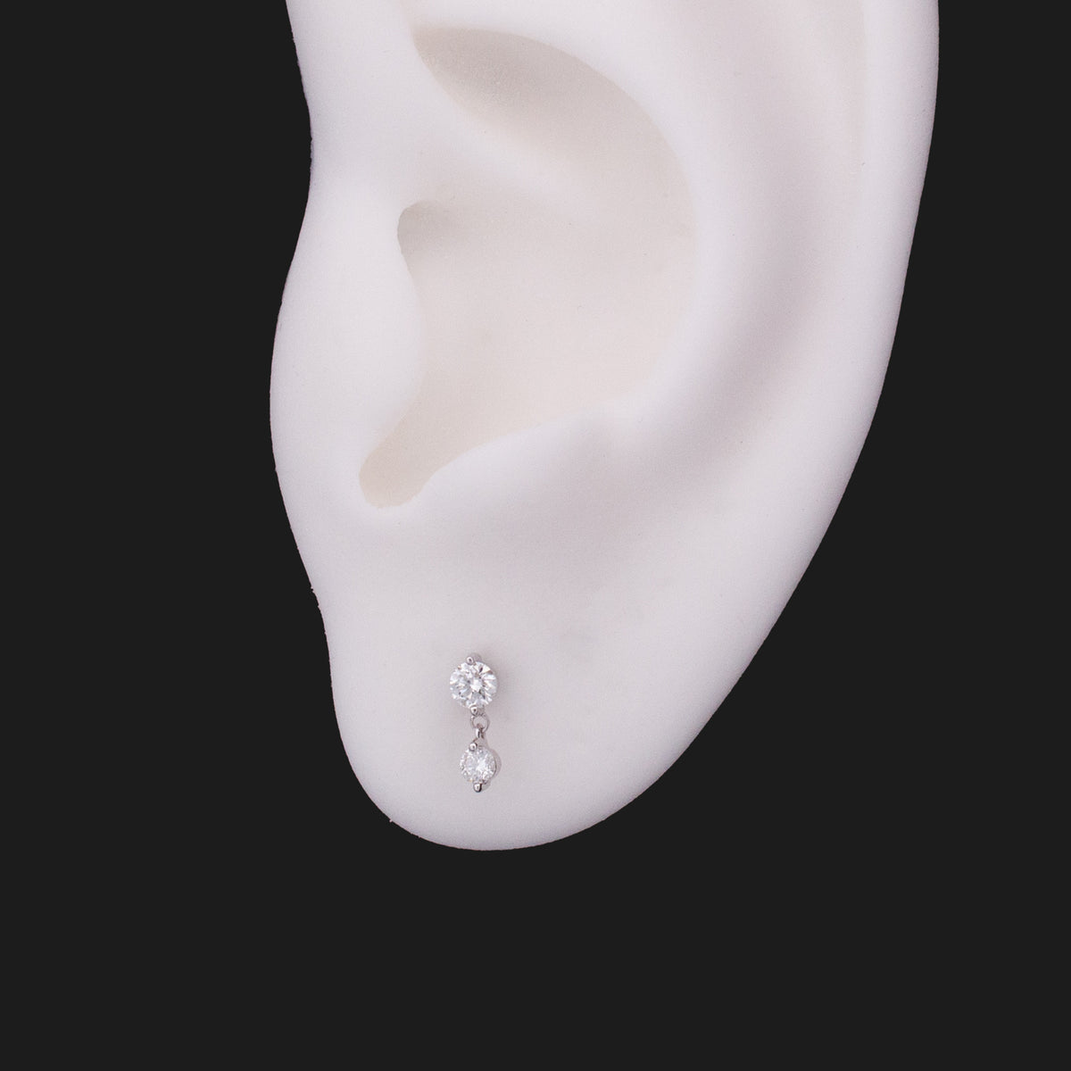 Fiat Lux Classic Twin Stars - White Diamond (2.5mm) 14K gold earring with two dangling stones on a white ear model.
