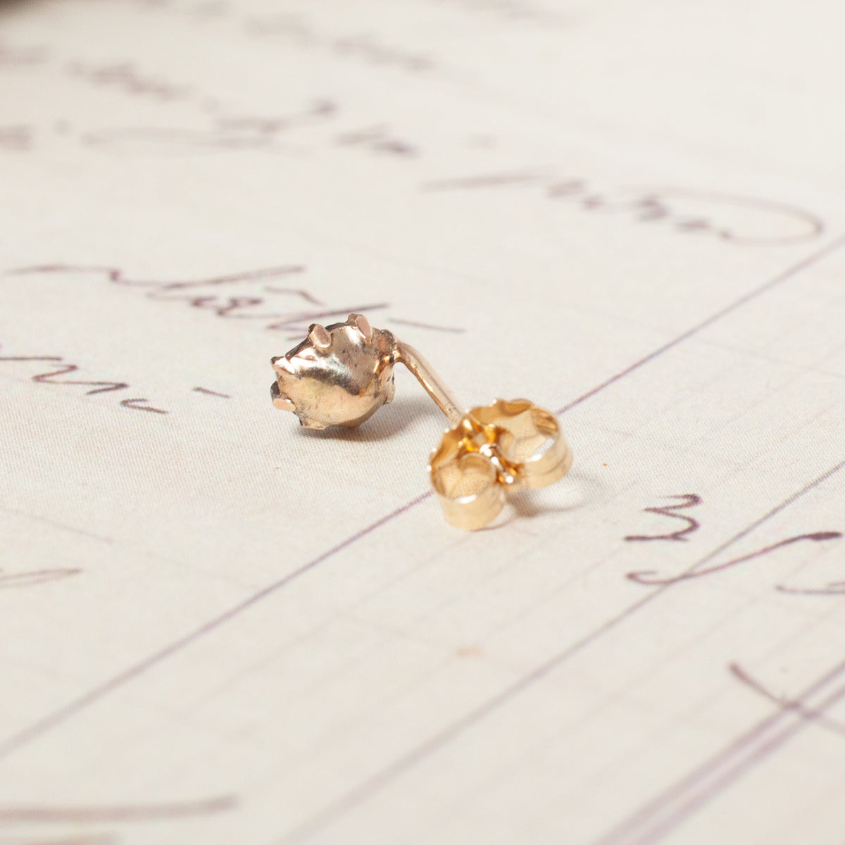 Vintage Victorian Rose Cut Single Earring, a vintage gold stud with a rose-cut gemstone setting and a matching back.