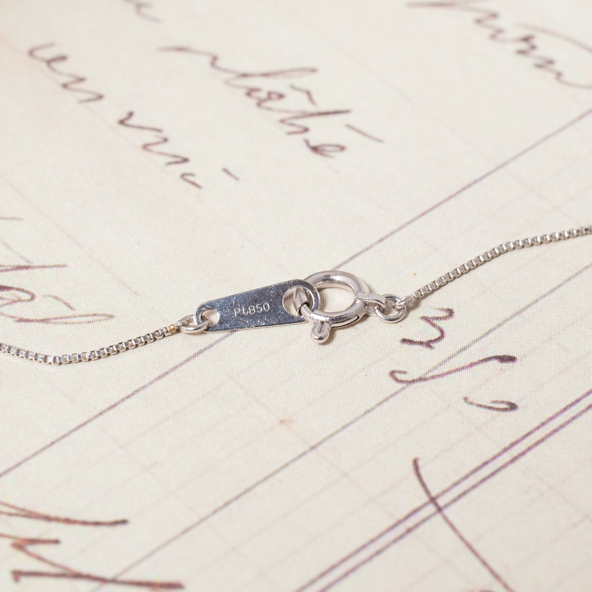 A thin Vintage Platinum Slim Box Chain necklace with a spring-ring clasp stamped Pt850.