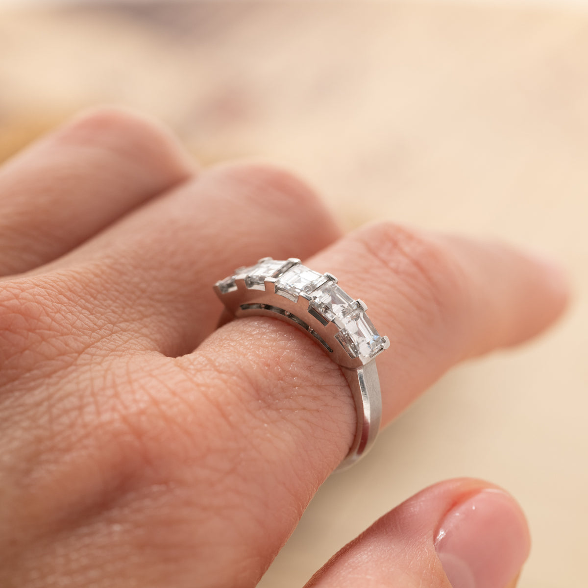 A Vintage Carré Cut Diamond Band (2.04ct) - 5mm featuring five silver-set carré cut diamonds worn on a finger.