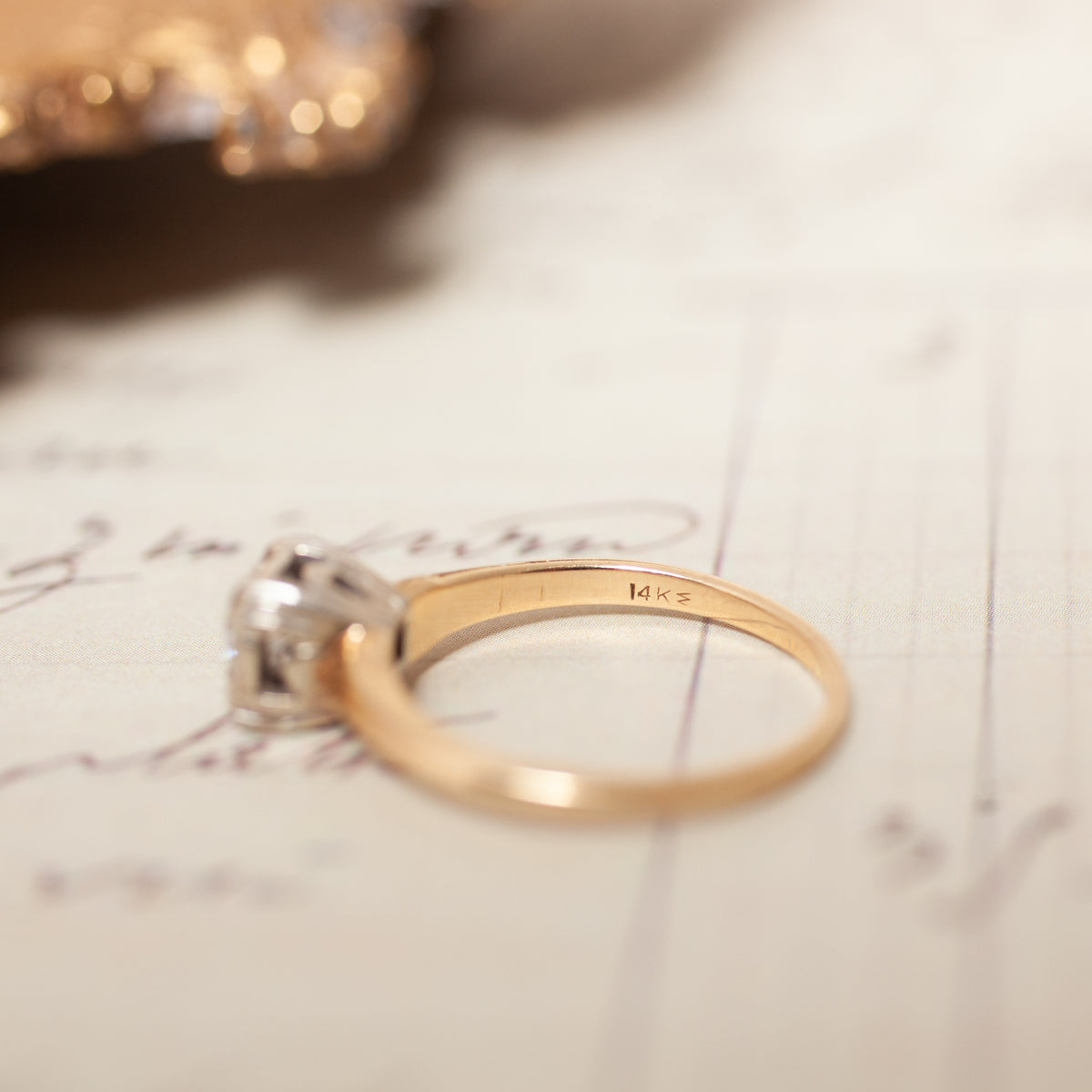 Vintage Two Tone Diamond Ring in 14K gold with a hallmark stamped on the inner band.