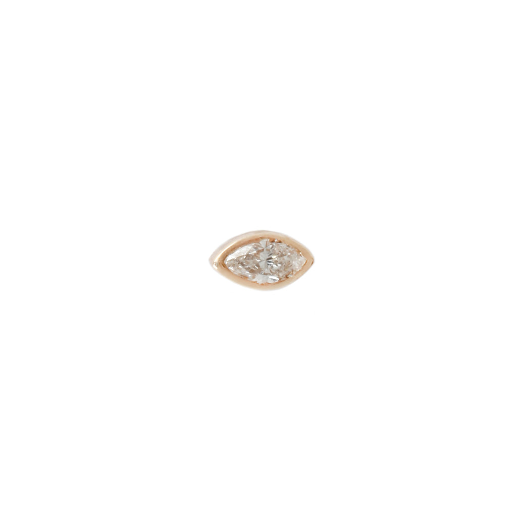 The Fiat Lux Littlest Evil Stud features a white diamond in 14K gold—an elegant marquise flatback piercing.