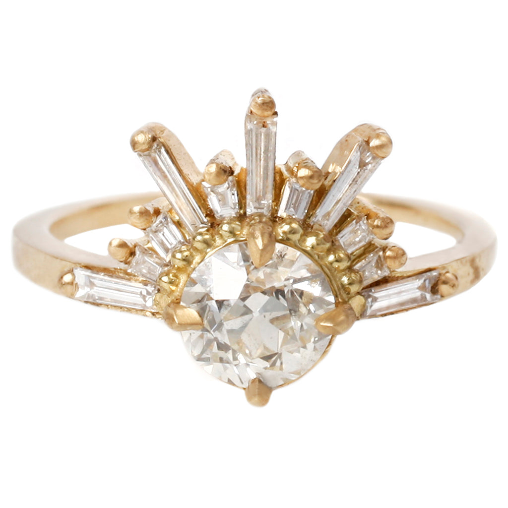 Old European Cut diamond with 11 baguette diamonds fanning out from the top in a sunburst formation