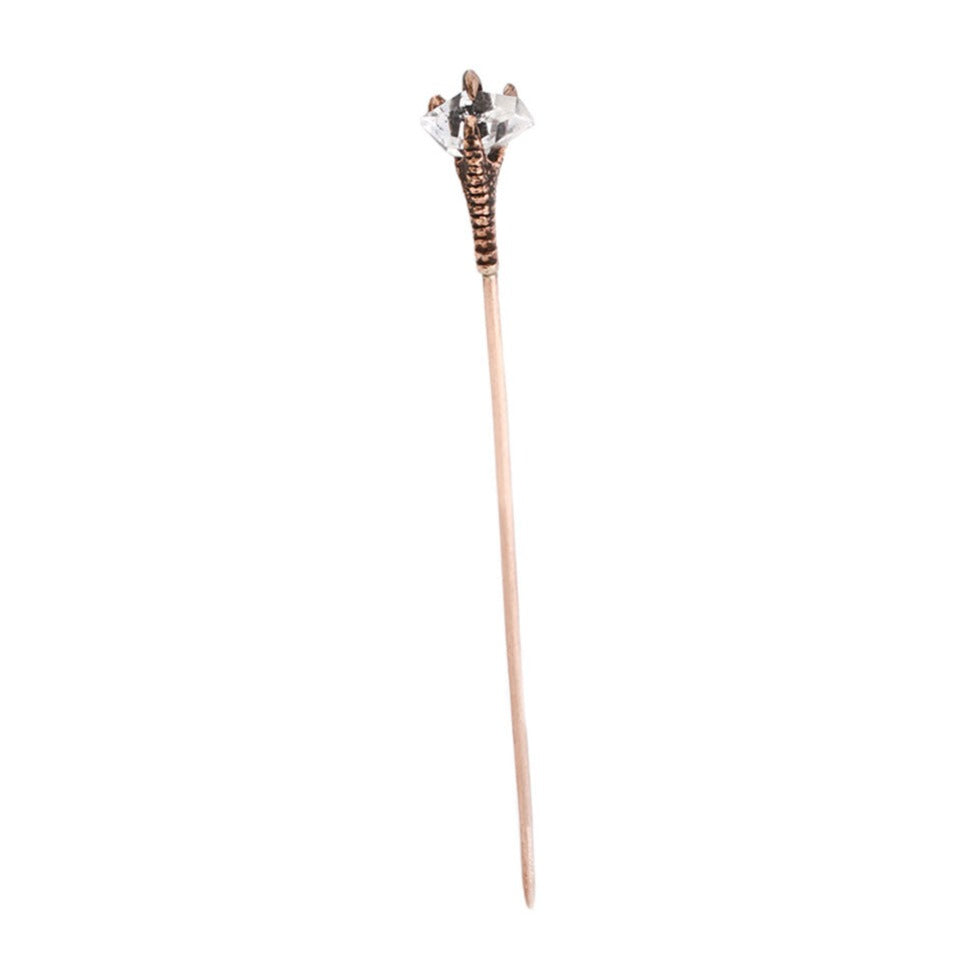 Bird claw holding a herkimer quartz with a spike for your ears