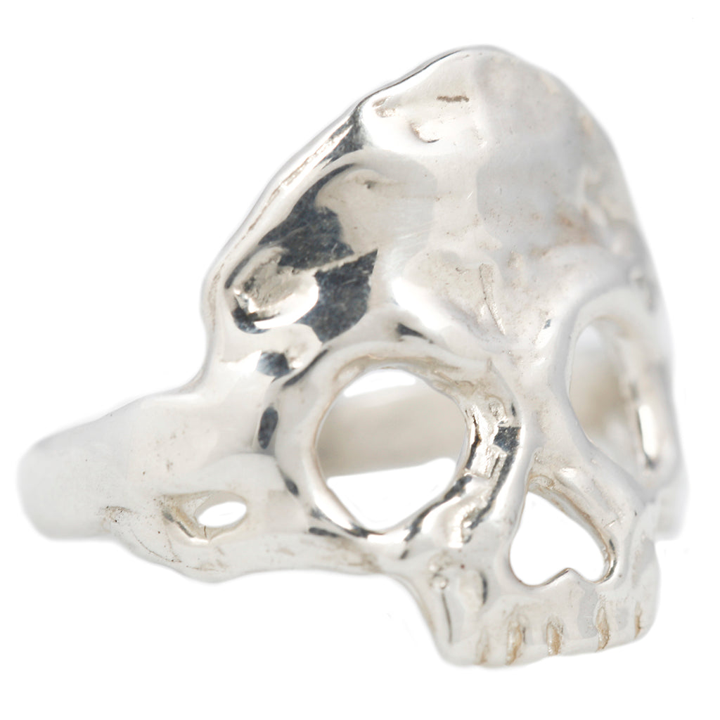 dust to dust sterling silver skull ring by maragaret cross turned on a side profile to the right on a white background